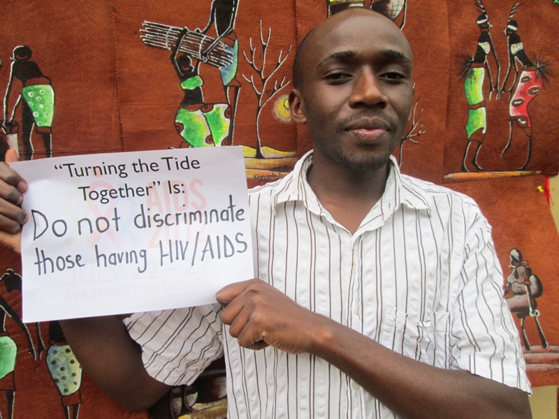 Turning the tide together - activist holds banner against discrimination