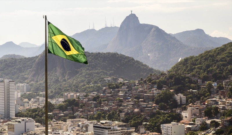 Brazilian flag with Rio in the background